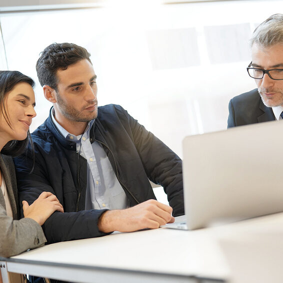 young couple meeting financial advisor for home investment