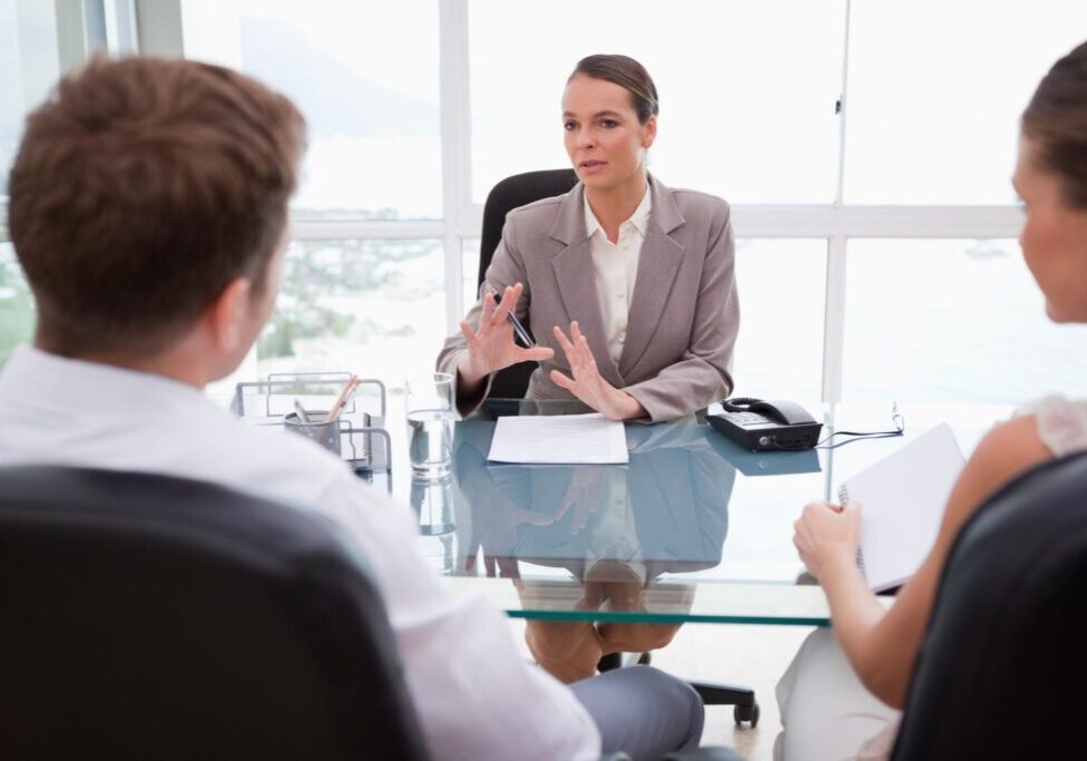 a female attorney discussing to the couple