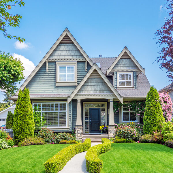 cozy house with beautiful landscaping on a sunny day. home exterior.